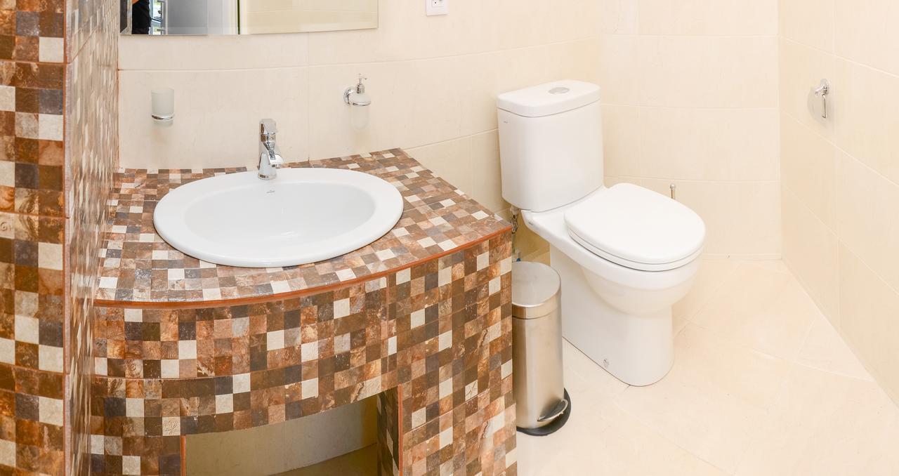 Captain Hotel Zatoka Bagian luar foto